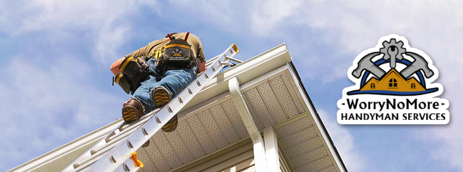 Handyman working on a roof using a ladder for home repairs